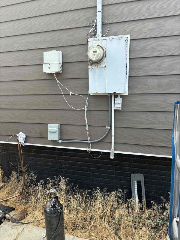 Completed a 100-amp meter socket and load center upgrade with main breaker rated for 16/24 circuits. Installed NEMA 3-rated weatherproof panel, new riser with weatherhead and guy wire support, service entrance cable (SER), proper panel grounding system with dual ground bars and grounding conductors. Coordinated with utility company for meter disconnect and power shutdown, obtained required permit, and set up temporary power to maintain air conditioning during installation. Replaced corroded meter base and mounting hardware, installed new weatherproof disconnect, and established compliant conduit runs connecting all components. All work completed to code specifications and passed final inspection.