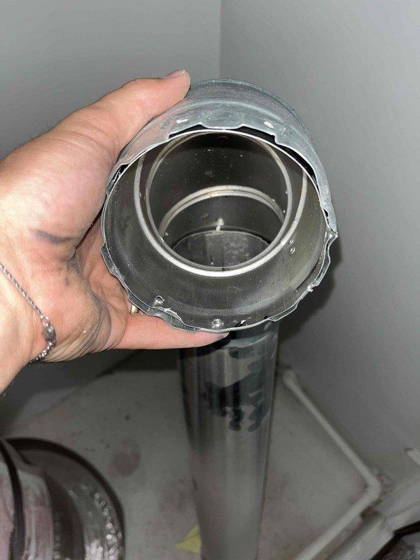 Responded to emergency service call for 2-year-old tank-style water heater in second floor utility closet following carbon monoxide alarm activation. Fire department and gas utility had shut down unit due to inadequate combustion air supply. Inspected combustion air intake system and identified blocked or restricted ventilation pathway preventing proper air circulation to water heater. Cleared obstruction from intake vent and verified proper airflow through combustion air supply. Restored adequate ventilation to meet manufacturer specifications and code requirements for safe operation. Coordinated with gas utility for system reactivation and return to service.