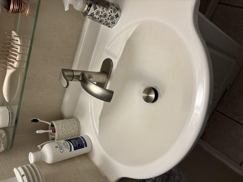 Responded to service call for continuously running toilet and leaky bathroom sink faucet. Repaired 20-year-old toilet by replacing worn internal flush valve components and flapper assembly to eliminate constant running condition. Replaced existing bathroom sink faucet with customer-provided single-handle brushed nickel fixture, including installation of new supply lines and proper sealing of deck plate. Both fixtures tested and verified operational with no leaks upon completion.