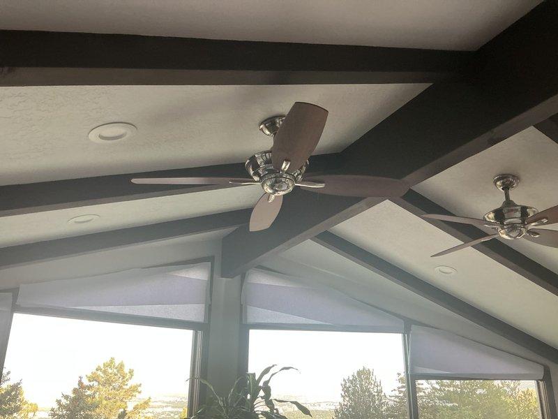 Responded to service call for two ceiling fans in vaulted ceiling area with one fan inoperative and the other experiencing receiver issues. Diagnosed non-functioning fan and determined receiver replacement necessary. Installed new AireControl RCS223 handheld remote control system with compatible receiver to restore proper fan operation and provide reliable wireless control functionality.