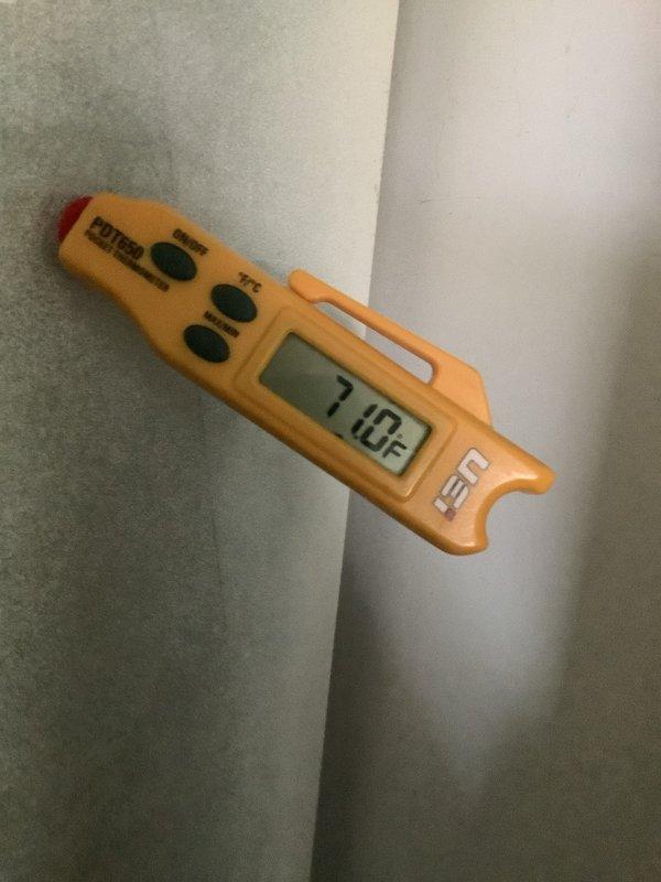 Completed routine HVAC maintenance visit including air conditioning tune-up as part of membership service. Inspected furnace closet on main floor and ground-level AC unit, verified thermostat operation showing 77°F on Honeywell Home ProSeries digital unit, and performed standard system diagnostics with temperature readings reaching 710°F during operational testing.
