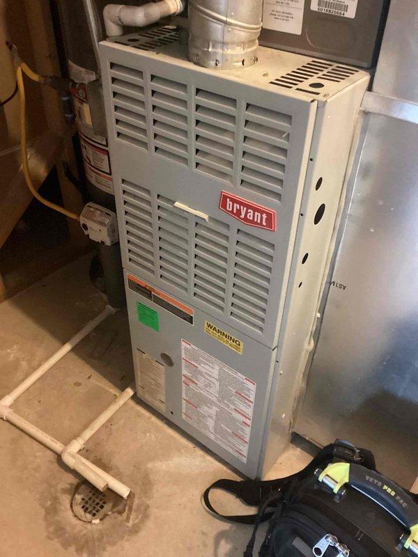 Completed membership maintenance tune-up on split system HVAC equipment including Bryant furnace located in interior utility closet and York condenser unit on exterior pad. Performed comprehensive air conditioning system inspection including refrigerant charge verification, electrical component testing, condenser coil cleaning, and airflow measurements. Inspected furnace components, verified proper venting through PVC flue system, checked gas connections and electrical systems, and replaced air filter. All equipment operating within manufacturer specifications with no deficiencies noted at time of service.