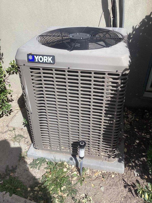 Completed membership maintenance tune-up on split system HVAC equipment including Bryant furnace located in interior utility closet and York condenser unit on exterior pad. Performed comprehensive air conditioning system inspection including refrigerant charge verification, electrical component testing, condenser coil cleaning, and airflow measurements. Inspected furnace components, verified proper venting through PVC flue system, checked gas connections and electrical systems, and replaced air filter. All equipment operating within manufacturer specifications with no deficiencies noted at time of service.