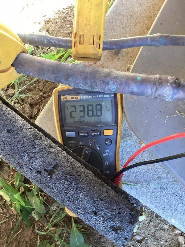 Completed comprehensive membership maintenance including A/C tune-up with outdoor condenser unit located in backyard and furnace system in basement. Verified system pressures using digital manometer showing 0.21" readings, confirmed proper electrical supply at outdoor disconnect measuring 238 volts with multimeter. Inspected furnace filter condition per customer request and provided replacement filter for future use when due for change.