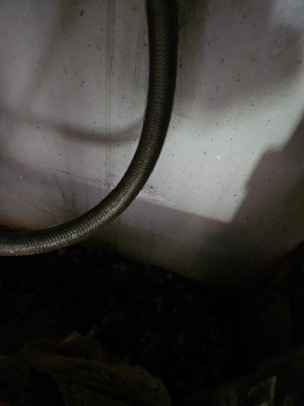 Responded to reported leak in basement area below kitchen with water infiltration near HVAC vent. Conducted thorough inspection of affected area including examination of exposed plumbing lines, ductwork, and insulation in crawlspace. Confirmed leak source as plumbing-related rather than HVAC condensate issue, consistent with property owner's observation that air conditioning system had not been in operation for over six weeks. Documented conditions with photographic evidence showing water damage to insulation materials and accumulation of moisture on surfaces near flexible supply lines.