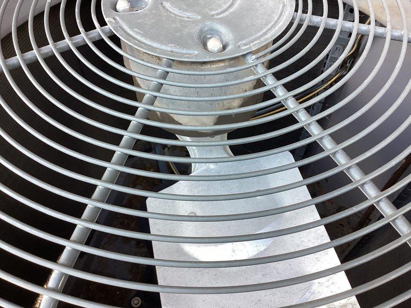 Responded to service call for potential refrigerant loss and suspected fan motor failure on 10+ year old single-zone cooling system. Performed comprehensive diagnostic evaluation of Tempstar furnace located in basement and outdoor condensing unit in backyard. Inspected condenser fan assembly through protective grille, observing normal surface weathering and minor dust accumulation on blades with no visible mechanical damage or obstruction. Evaluated refrigerant levels, electrical components, and overall system operation to determine root cause of cooling deficiency and verify fan motor functionality.