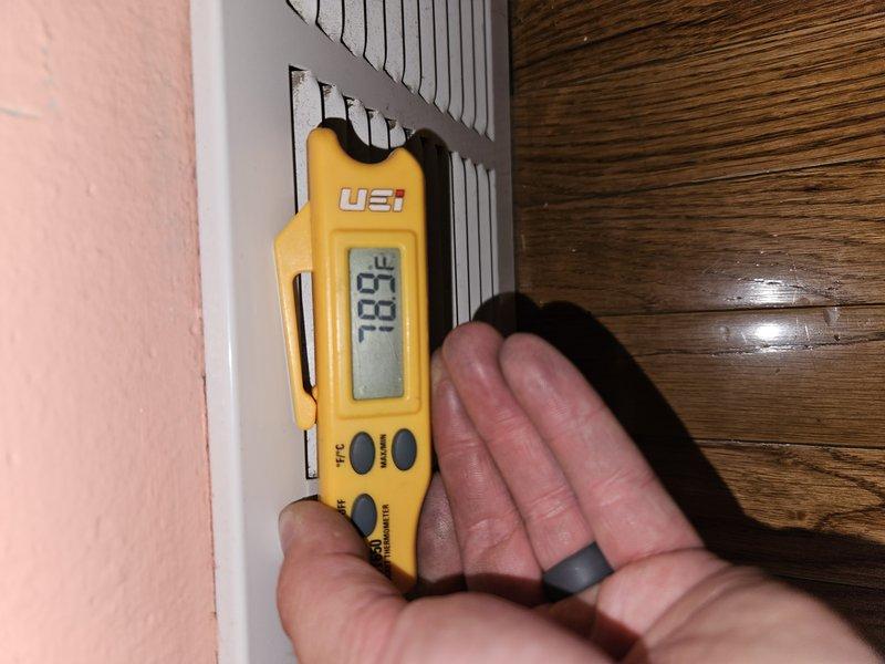Responded to no cooling complaint on residential air conditioning system. Performed diagnostic evaluation and temperature measurements at supply and return registers. Found system operating with low refrigeant charge and deficient capacitor affecting compressor performance. Contrary to previous diagnosis, confirmed compressor was still functional but system cooling capacity was significantly compromised. Identified probable refrigerant leak requiring location and repair. Presented customer with repair options including comprehensive leak search and repair, capacitor replacement, and refrigerant recharge. Documented temperature differential readings and system operating conditions with diagnostic equipment.