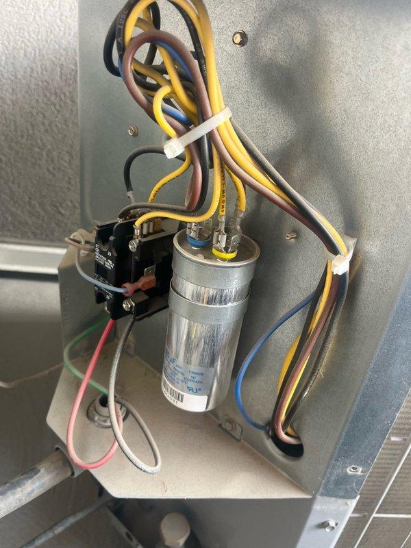 Completed membership air conditioning tune-up at residential condominium unit. Inspected electrical control panel components including capacitor and contactor relay, verified all wire connections secure with proper insulation intact. Performed pressure diagnostics using digital manometer, recorded readings of 0.30 and 0.96 inWC to verify proper system operation.