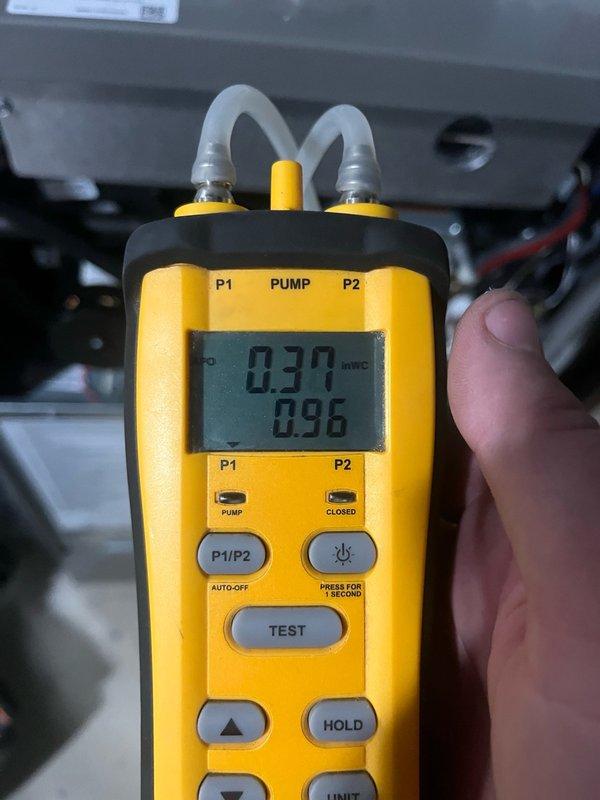 Completed membership air conditioning tune-up at residential condominium unit. Inspected electrical control panel components including capacitor and contactor relay, verified all wire connections secure with proper insulation intact. Performed pressure diagnostics using digital manometer, recorded readings of 0.30 and 0.96 inWC to verify proper system operation.