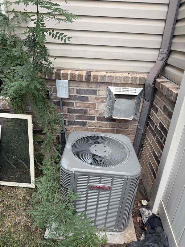 Responded to service call for furnace making excessive noise described as extremely loud operational sounds. Upon inspection, diagnosed failed blower motor bearings resulting in bent blower motor shaft and damaged blower wheel on 2008 furnace unit. Documented existing Lennox AC condenser unit located exterior and photographed furnace cabinet interior showing damaged blower assembly and mechanical components. Provided tech lead assessment and ballpark estimate for complete furnace replacement due to extent of mechanical failure and age of existing equipment.
