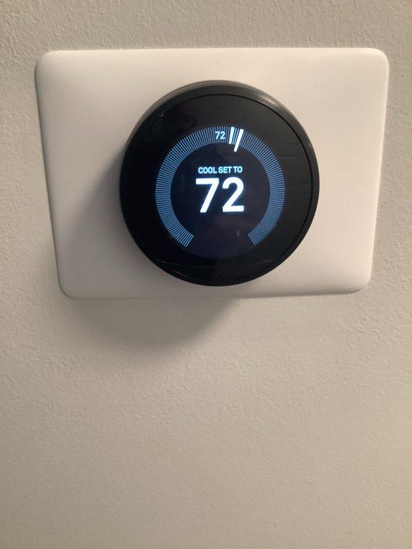 Completed comprehensive cooling maintenance on a 10+ year old single-unit HVAC system. Performed standard tune-up procedures including inspection of outdoor condenser unit located on right side of property and indoor furnace components in basement. Verified thermostat operation showing proper cooling setpoint at 72°F with system responding appropriately. Noted significant frost accumulation on evaporator coil assembly, indicating potential refrigerant flow restriction or airflow issues that will require monitoring during future service visits.
