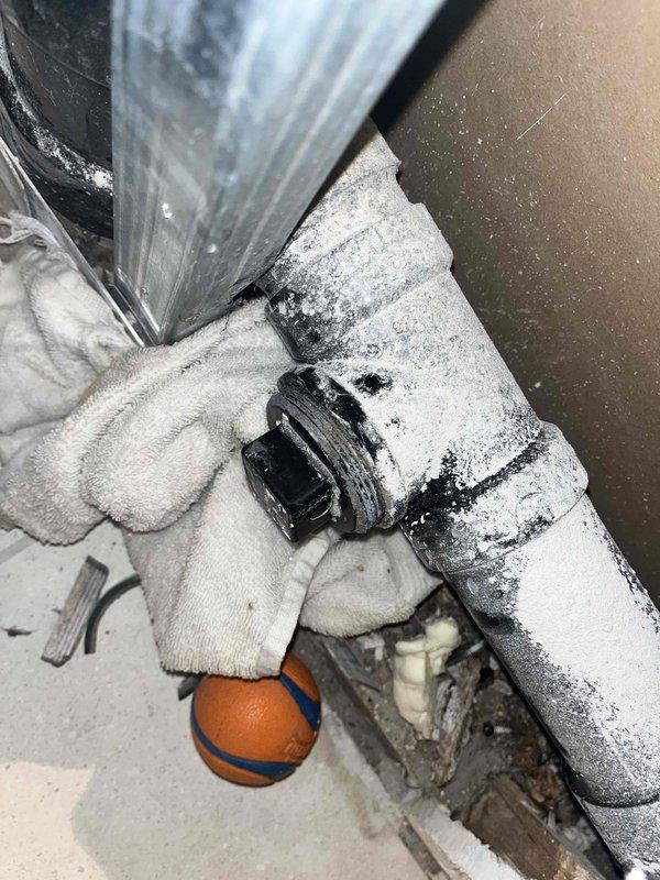 Responded to service call for damaged ABS cleanout tees near the sewer main resulting from previous contractor work where drywall installer had drilled through one cleanout plug. Assessed compromised plumbing system following major flood and remodel, determining that limited access and floor proximity required complete rebuild of affected drain sections. Relocated appliances to gain proper access to work area. Acquired specialized tools and utilized onboard materials to replace two broken and crunched ABS cleanout tees. Reconstructed plumbing assembly to code specifications, ensuring proper cleanout access and system integrity. Verified all connections were secure and leak-free upon completion.