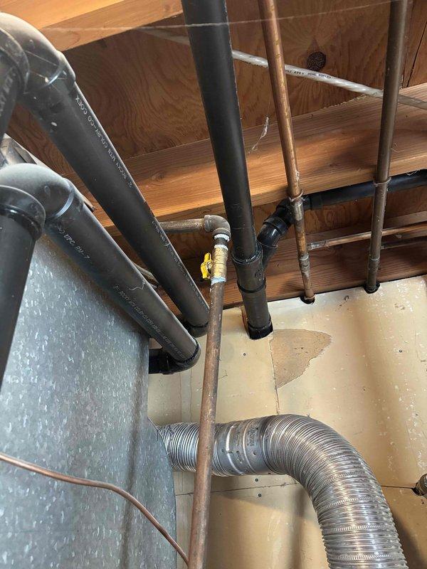 Installed a new 50-gallon gas water heater with complete code-compliant upgrades. Installation included new water and gas connections with dedicated shut-off valves and flexible supply lines. Unit was placed in a drain pan with piping routed to floor drain for leak containment. Installed seismic safety straps to secure unit per local requirements. Mounted new thermal expansion tank and pressurized to match existing house water pressure. All gas connections were tested for leaks and verified safe. Water supply lines and connections were pressure tested and confirmed operational.

Additionally performed plumbing repairs in bathroom areas. Used hand auger to clear obstruction in bathroom drain line, restoring proper drainage. Replaced worn flapper valve in master bathroom toilet with American Standard traditional-style flapper, resolving running water issue and restoring proper flush function.

All work was performed in accordance with local plumbing codes. Required permits were obtained 
