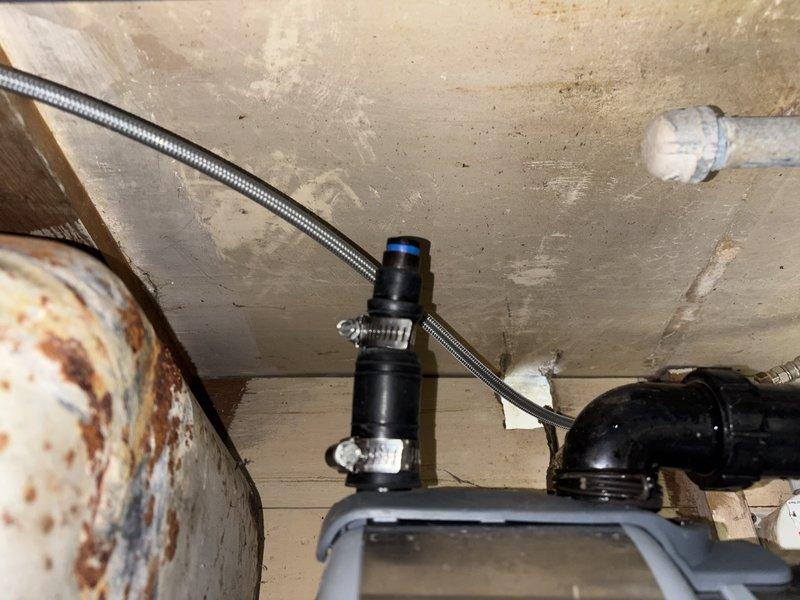 Completed callback service to address incomplete work from previous visit. Kitchen sink disposal was not properly connected to drain system during initial service call, resulting in water leaking onto floor when sink was in use. Successfully installed and connected disposal unit to existing drain plumbing, tested system for proper drainage and verified no leaks present at connections or trap assembly.