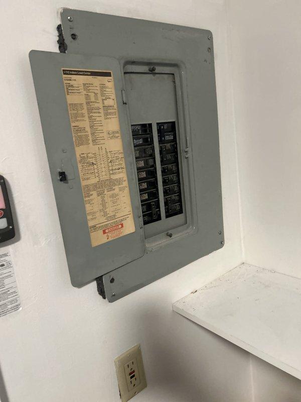 Completed comprehensive Green Shield electrical inspection of residential electrical system. Inspected main circuit breaker panel, verified proper breaker operation and labeling, and examined multiple outlets throughout the property including modern combination USB/standard receptacle. All electrical components found to be functioning properly with no safety concerns identified.