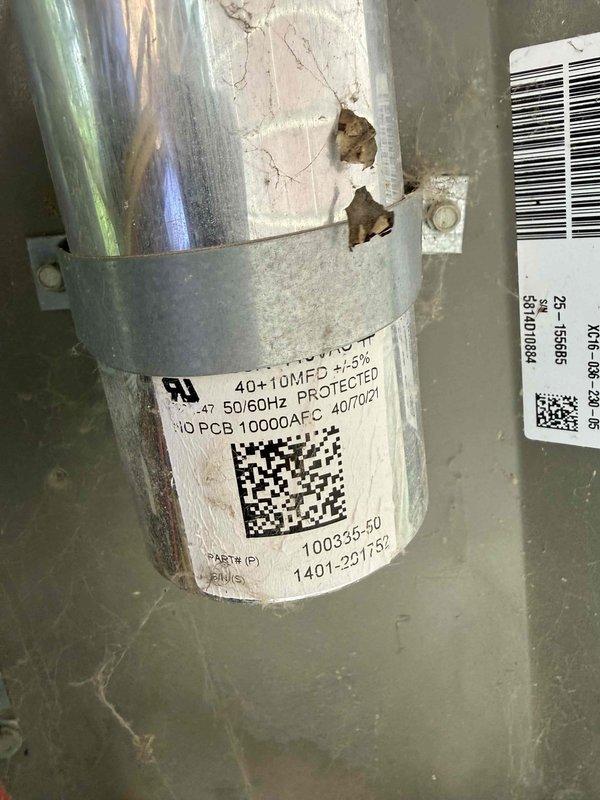 Completed Gold-level heating and cooling maintenance on 8-year-old residential HVAC system consisting of one furnace and one air conditioning unit. Performed comprehensive inspection of both systems, including filter examination which revealed heavy dust and debris accumulation requiring attention. Inspected dual-run capacitor rated at 40+10 MFD, 370 VAC, manufactured in October 2021, confirmed proper operation within specifications. Noted visible deterioration and rust staining on lower filter frame assembly with accumulated grime present. Observed wear patterns on air handler housing and surrounding components consistent with system age. Checked all accessible mechanical and electrical components per Gold maintenance protocol standards, ensuring proper system operation for both heating and cooling functions.