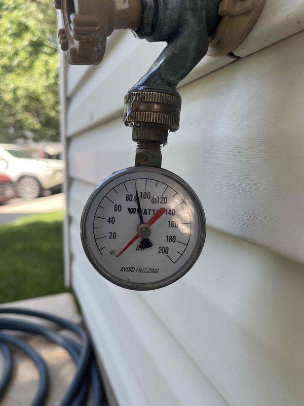 Responded to a water pressure concern at the residence. Inspected the main gas shut-off valve serving the standard water heater and verified proper operation of the quarter-turn ball valve. Installed a new pressure gauge on the exterior water supply line to monitor incoming water pressure, securing the gauge with appropriate fittings and clamps to provide the homeowner with accurate pressure readings for ongoing system monitoring.