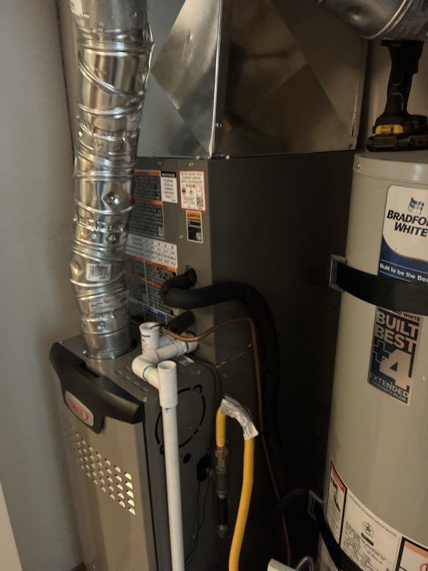 Completed full HVAC system changeout including removal of existing equipment and installation of new Lennox Elite Series 2-ton 18 SEER variable speed air conditioner (Model #EL18KCV-024) and Lennox Signature Series 3-ton 70,000 BTU 80% AFUE 2-stage variable speed upflow furnace (Model #SL280UH070V36AK). Installed Lennox CK40CT-18/24A-71 cased aluminum upflow evaporator coil rated for R454B refrigerant. Mounted furnace on elevated base per specifications to raise unit off ground level. Reused existing lineset after performing thorough flush to ensure system cleanliness and compatibility. Installed 20x25x1 filter rack with new filter for improved air quality and system maintenance accessibility. Replaced existing thermostat with iComfort S40 touchscreen smart thermostat configured for universal 3 heat/2 cool operation with communicating capabilities. Connected all electrical, gas, and condensate drainage lines. Verified proper airflow, refrigerant charge, and system operation. System tes