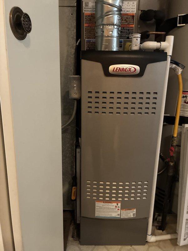 Completed full HVAC system changeout including removal of existing equipment and installation of new Lennox Elite Series 2-ton 18 SEER variable speed air conditioner (Model #EL18KCV-024) and Lennox Signature Series 3-ton 70,000 BTU 80% AFUE 2-stage variable speed upflow furnace (Model #SL280UH070V36AK). Installed Lennox CK40CT-18/24A-71 cased aluminum upflow evaporator coil rated for R454B refrigerant. Mounted furnace on elevated base per specifications to raise unit off ground level. Reused existing lineset after performing thorough flush to ensure system cleanliness and compatibility. Installed 20x25x1 filter rack with new filter for improved air quality and system maintenance accessibility. Replaced existing thermostat with iComfort S40 touchscreen smart thermostat configured for universal 3 heat/2 cool operation with communicating capabilities. Connected all electrical, gas, and condensate drainage lines. Verified proper airflow, refrigerant charge, and system operation. System tes