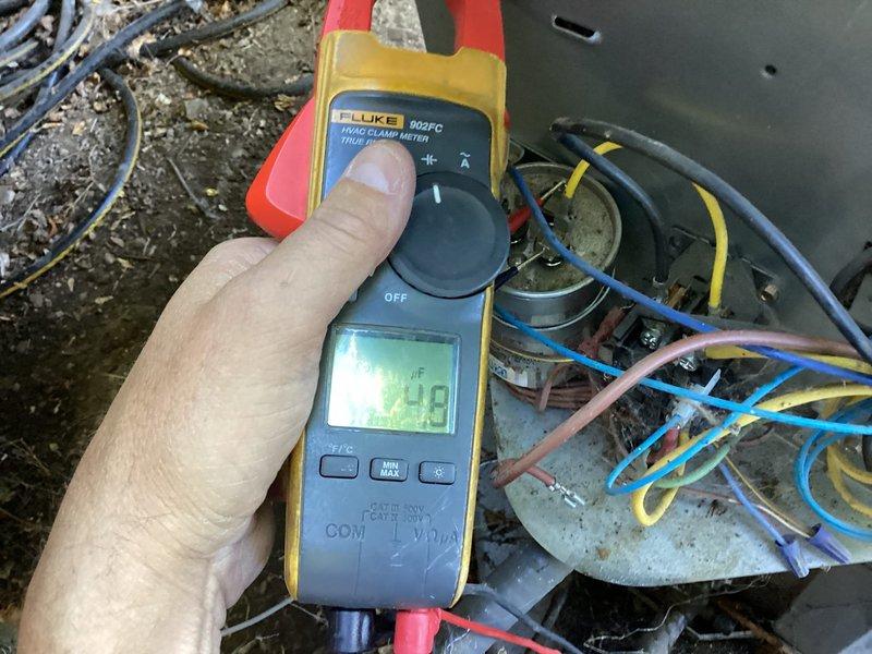 Completed annual cooling maintenance on 12-year-old single-zone system with outdoor condenser unit and furnace located in crawlspace accessible through closet. Performed comprehensive tune-up inspection of ground-mounted condensing unit, including electrical diagnostics using clamp meter to verify amperage draws and component operation. Inspected heat exchanger coils, fan assembly, refrigerant lines, and electrical connections. Replaced air filter as part of routine maintenance protocol. No issues reported by customer prior to visit; system found operating within normal parameters upon completion of preventative maintenance service.