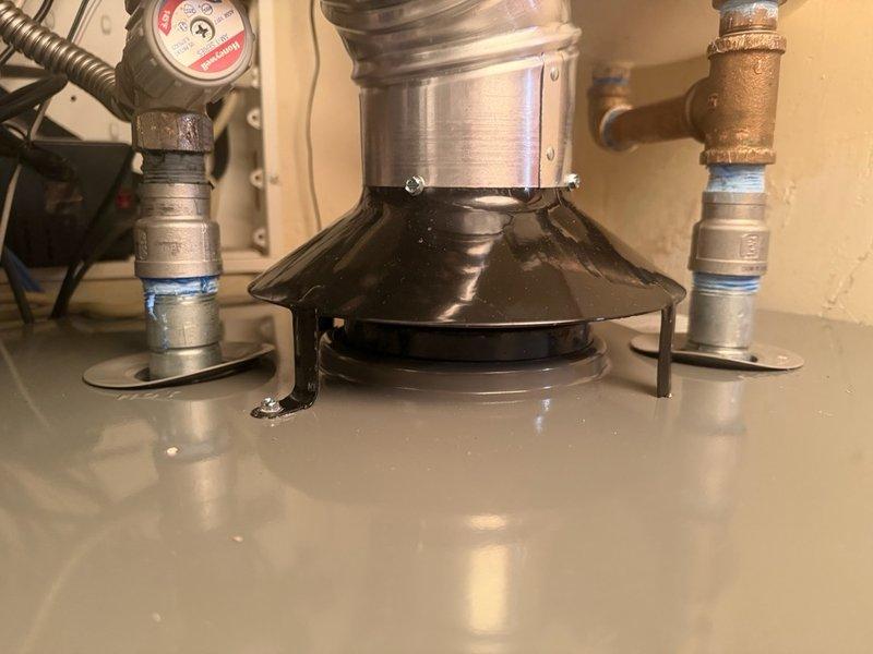 Completed warranty water heater replacement due to failed gas control valve. Removed existing unit and installed new gas-fired water heater with proper venting through existing roof penetration. Connected all supply and discharge lines using flexible connectors with compression fittings. Installed temperature and pressure relief valve with appropriate discharge piping. Verified proper combustion air supply and inspected roof vent cap for secure mounting and adequate clearance. All gas connections tested and confirmed leak-free. Unit fired successfully with proper flame characteristics and temperature control verified operational.