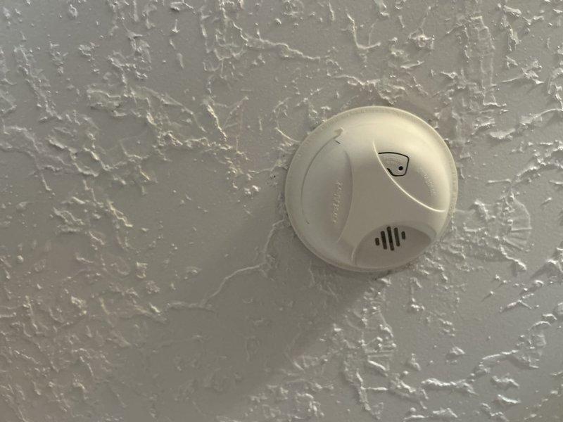 Completed routine membership electrical inspection of residential property with no reported issues. Verified proper operation and mounting of smoke detectors throughout the home, confirming all units were securely installed on textured ceiling surfaces with clear indicator lights and adequate ventilation. All electrical safety devices inspected were found to be in satisfactory working condition.