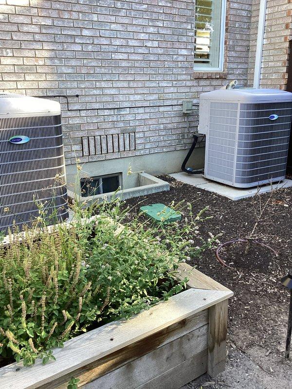 Completed Gold level preventative maintenance on two complete HVAC systems at residential property. Performed comprehensive heating maintenance on both furnaces, including one Carrier 59MN7A100V211222 unit located in basement (manufactured July 2012) and second unit in upstairs closet. Conducted full cooling maintenance on two exterior condenser units positioned on ground-level concrete pads along exterior brick wall. All systems inspected, tested, and confirmed operational per manufacturer specifications.