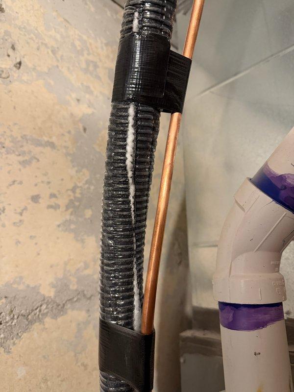 Responded to reported frozen line and leak at blower-furnace unit. Inspected condensate drainage system and evaporator coil assembly in basement. Found dirty air filter restricting airflow, which was contributing to system freezing. Verified condensate drain line routing and confirmed proper drainage through PVC piping. Recommended filter replacement to restore adequate airflow and prevent future freeze-ups.