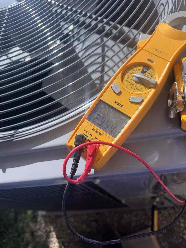 Completed comprehensive air conditioning maintenance tune-up as part of member maintenance program. Performed full system diagnostics on outdoor condensing unit, including electrical testing and measurement of operating voltages and amperage using digital multimeter. Inspected condenser fan assembly and protective grille for proper operation and clearance. All electrical readings were within manufacturer specifications. Left membership program materials with system documentation for customer reference. System operating efficiently with no deficiencies noted.