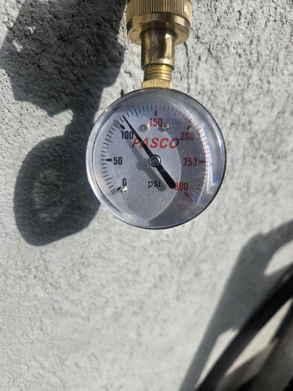Responded to no hot water complaint on 6.5-year-old residential tank water heater. Upon arrival, confirmed unit was displaying 7 flashes on gas control valve status indicator, diagnostic code indicating gas control/valve failure. Inspected water heater and photographed control panel showing fault condition and system pressure gauge reading. Verified complete loss of hot water production and determined gas control valve requires replacement to restore functionality.