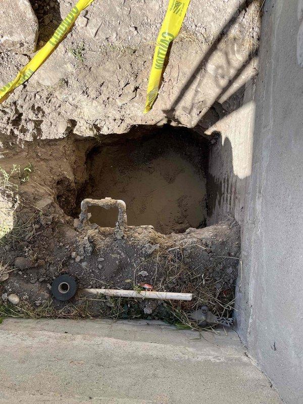 Completed full water main repair with excavation to access damaged line. Replaced main water shutoff valve and pressure reducing valve inside residence. Coordinated with municipal authorities regarding permit requirements and restored site upon completion.