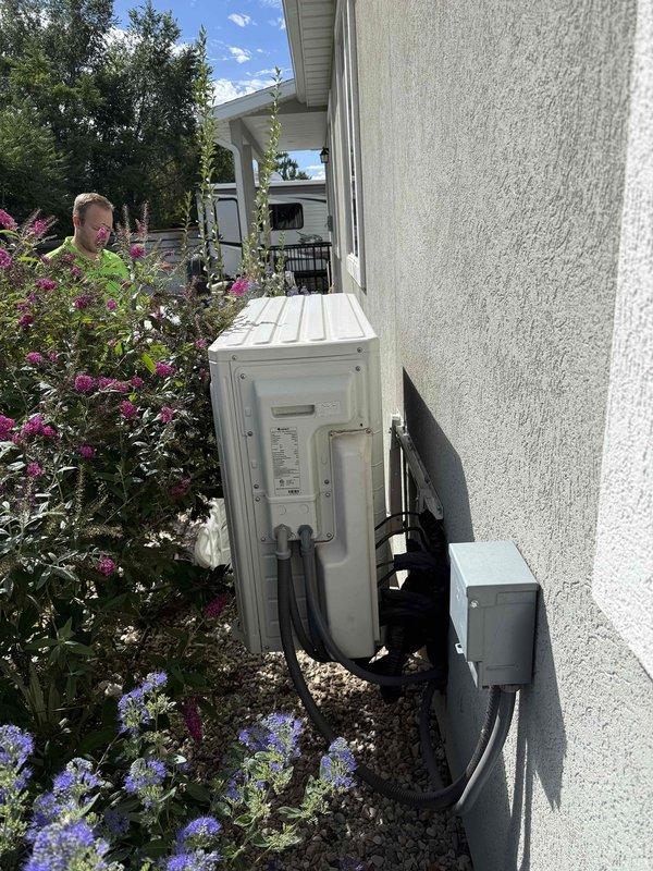 Responded to service call for non-operational Gree ductless mini-split system serving single room, originally installed in 2021. System has experienced repeated failures requiring multiple refrigerant recharges, indicating persistent refrigerant leak that has not been successfully resolved through previous repair attempts. Performed on-site assessment of both indoor wall-mounted evaporator unit and outdoor condensing unit. Documented current system condition and configuration including refrigerant line routing and electrical disconnect. Provided comprehensive replacement estimate for complete mini-split system due to ongoing reliability issues and impracticality of continued leak repair attempts on existing equipment.