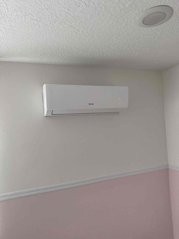 Responded to service call for non-operational Gree ductless mini-split system serving single room, originally installed in 2021. System has experienced repeated failures requiring multiple refrigerant recharges, indicating persistent refrigerant leak that has not been successfully resolved through previous repair attempts. Performed on-site assessment of both indoor wall-mounted evaporator unit and outdoor condensing unit. Documented current system condition and configuration including refrigerant line routing and electrical disconnect. Provided comprehensive replacement estimate for complete mini-split system due to ongoing reliability issues and impracticality of continued leak repair attempts on existing equipment.