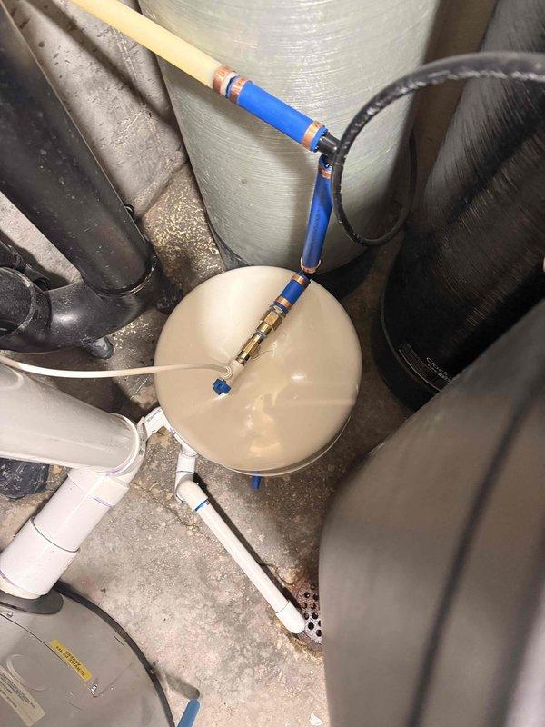 Replaced storage tank for reverse osmosis system and installed new filters including big blue sediment filter and phosphate filter. System was tested for proper operation, connections were verified leak-free, and water quality output was confirmed to meet specifications.