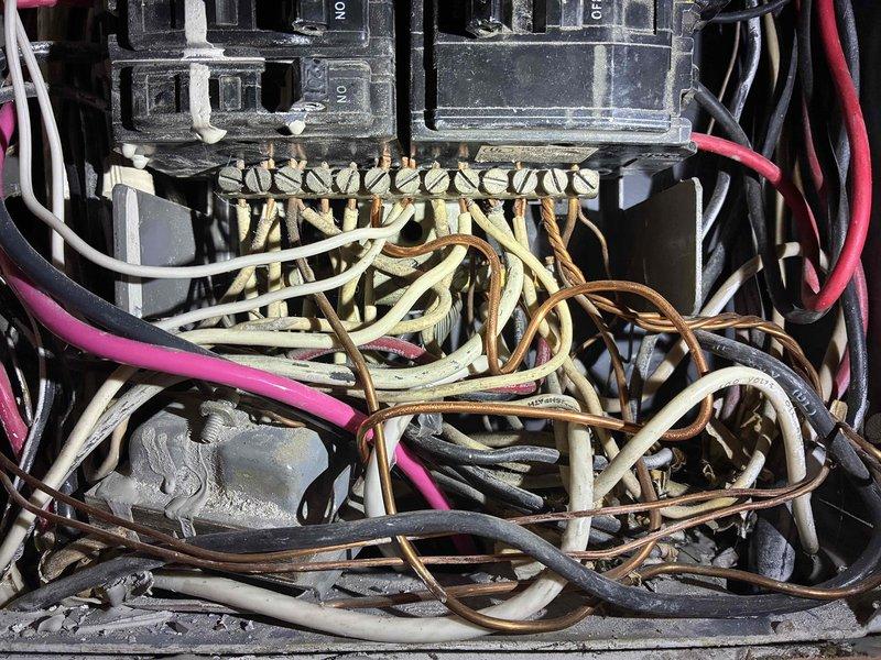 Completed annual membership electrical maintenance inspection and safety evaluation. Performed comprehensive assessment of main electrical panel, documenting existing conditions including aged wiring with visible heat discoloration and deteriorated insulation throughout the breaker box. Inspected all circuit breakers for proper operation, verified connections at bus bars, and evaluated overall panel integrity. Noted significant wire degradation, tangled conductor arrangement, and dust accumulation requiring attention. Photographed panel conditions for customer records. Advised property owner of findings and recommended scheduling follow-up service to address deteriorated wiring conditions and improve electrical safety compliance.