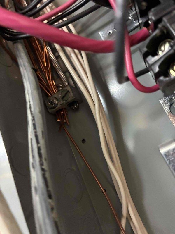 Completed annual electrical maintenance inspection as part of member preventative maintenance program. Performed comprehensive safety inspection of main electrical panel, verified all circuit breakers for proper operation and secure connections, inspected bus bar connections and main lugs for signs of heat damage or loose terminations, and examined all branch circuit wiring for proper color coding and secure attachment points. Checked grounding bar connections and confirmed all neutral and ground wires were properly terminated, and documented panel condition with photographic evidence showing BOX TL1215 panel interior with organized wire routing and functional circuit protection devices.