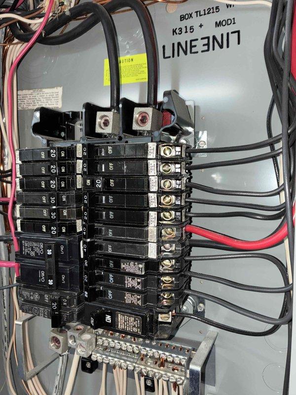 Completed annual electrical maintenance inspection as part of member preventative maintenance program. Performed comprehensive safety inspection of main electrical panel, verified all circuit breakers for proper operation and secure connections, inspected bus bar connections and main lugs for signs of heat damage or loose terminations, and examined all branch circuit wiring for proper color coding and secure attachment points. Checked grounding bar connections and confirmed all neutral and ground wires were properly terminated, and documented panel condition with photographic evidence showing BOX TL1215 panel interior with organized wire routing and functional circuit protection devices.