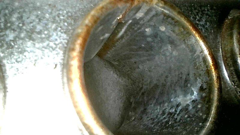 Performed furnace tune-up and diagnostics to address reported rattling and revving noises from HVAC system. Inspected 2-year-old tank water heater in basement as part of membership maintenance visit. Upon inspection, identified significant corrosion and rust buildup on water heater components, including heavily deteriorated pipe fittings, compression valves, and connection points showing advanced oxidation and mineral deposits, indicating extended exposure to moisture without proper maintenance.