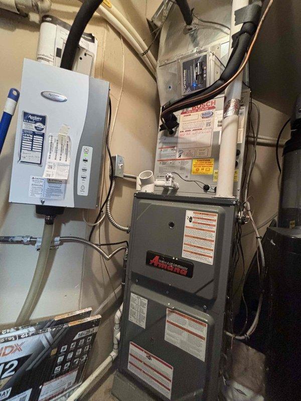 Completed annual preventative maintenance on residential heat pump and gas furnace system as part of membership agreement. Inspected outdoor heat pump unit and indoor furnace located in garage closet, both approximately 2-3 years old. Verified system operation, measured temperature differentials using digital thermometer, and inspected air handler, ductwork, refrigerant lines, and connected air purification equipment. No deficiencies noted; all components operating within normal parameters.