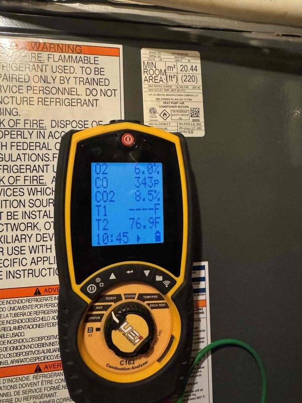 Completed comprehensive Green Shield cooling maintenance on single HVAC system located in basement. Performed full system diagnostics using combustion analyzer, recording oxygen levels at 6.04%, carbon monoxide readings, and temperature differentials (343°F and 76.9°F) to verify proper furnace operation and combustion efficiency. Inspected thermostat wiring configuration, confirming all wire connections secure at terminal blocks including green, red, yellow, blue, and white conductors. Verified refrigerant warning labels and equipment specifications present and legible per federal regulations. All equipment operating within manufacturer specifications with no reported issues or deficiencies found during inspection.