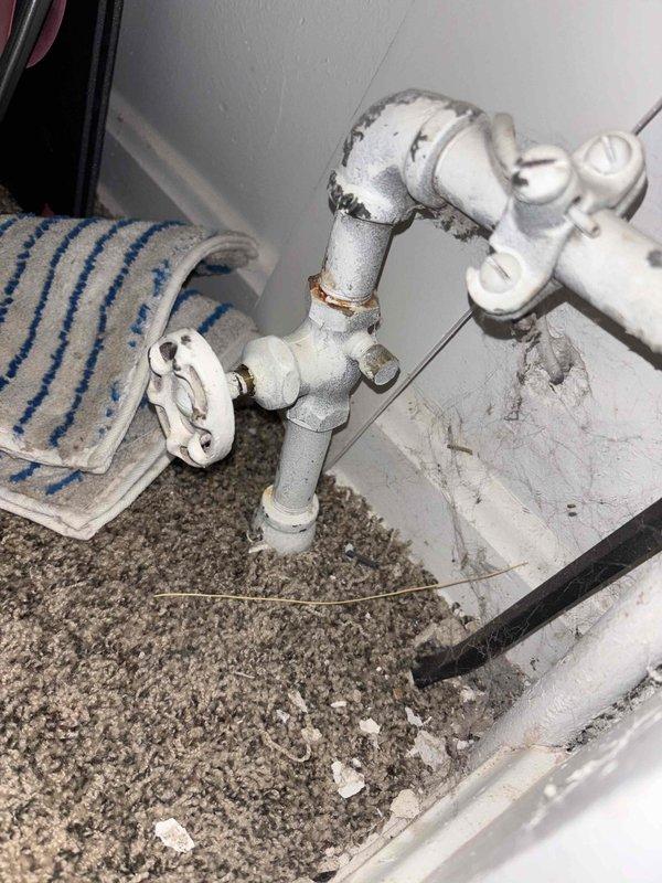 Responded to master bathroom for reported toilet supply valve failure where water continued to flow despite valve being in closed position. Inspected 40-year-old toilet fixture and confirmed shut-off valve was not seating properly, allowing continuous water flow to fill valve. Replaced defective angle stop valve with new quarter-turn ball valve and verified complete water shut-off capability upon completion.