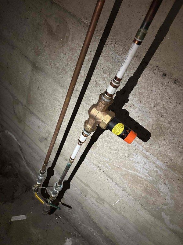 Responded to master bathroom for reported toilet supply valve failure where water continued to flow despite valve being in closed position. Inspected 40-year-old toilet fixture and confirmed shut-off valve was not seating properly, allowing continuous water flow to fill valve. Replaced defective angle stop valve with new quarter-turn ball valve and verified complete water shut-off capability upon completion.