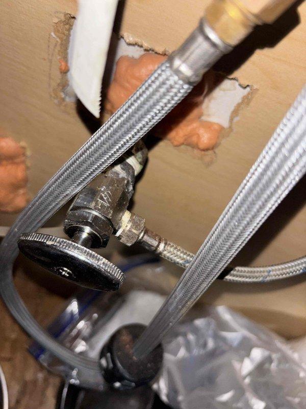 Responded to multiple fixture leaks in upstairs bathroom and downstairs kitchen. Addressed leaking bathtub faucet and kitchen faucet by inspecting supply connections, angle stop valves, and flexible braided supply lines. Replaced corroded shut-off valves showing significant rust and oxidation at wall connection points. Installed new chrome-finished angle stop valves and braided stainless steel flex lines to restore proper water control and eliminate active leaks. All fixtures tested and verified leak-free upon completion.