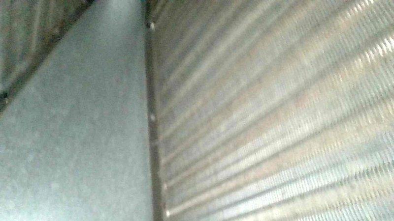 Responded to no-heat call on 5-6 year old furnace system located in basement. Upon arrival, confirmed unit was blowing cold air with reported gas odor present at initial startup. Performed complete system inspection including heat exchanger examination, burner assembly evaluation, and gas valve operation check. Inspected ductwork connections and refrigerant lines for proper sealing and secure mounting. Verified all safety controls, flame sensor operation, and ignition sequence functionality. Addressed issue causing cold air discharge and resolved gas odor concern to restore proper heating operation.