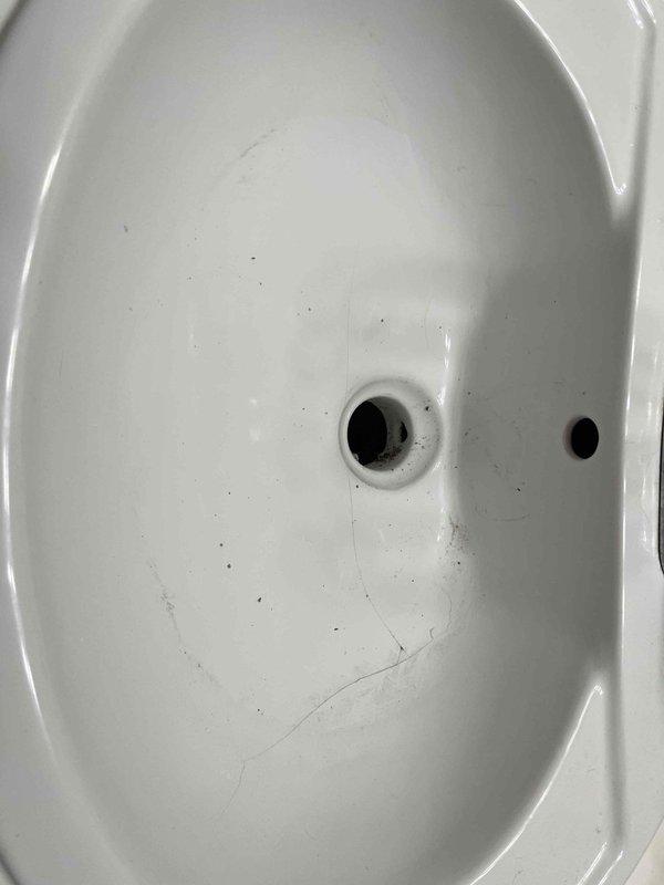 Responded to master bathroom sink draining slowly due to clog in the drain line. Upon arrival, confirmed no chemical drain cleaners had been used in the last 24 hours. Performed mechanical snaking of the sink drain to clear the obstruction and restore proper drainage flow. Tested the fixture after clearing to verify water drains freely without backup or slow drainage issues.