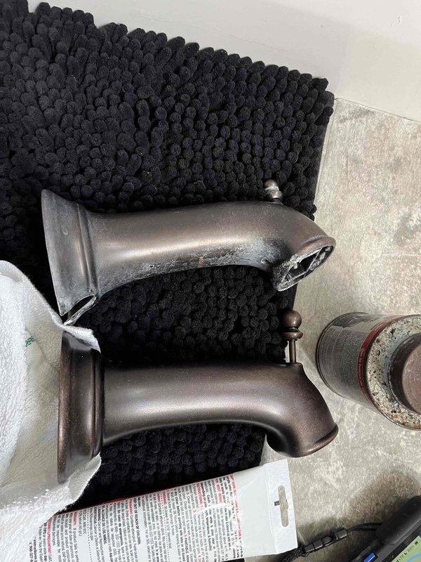 Responded to service call addressing three plumbing issues in residential property. Inspected laundry room drain experiencing foul odors, identifying potential trap or venting concerns. Evaluated and repaired leaking outdoor hose bib, replacing worn components including corroded pipe fittings and connections. Diagnosed and resolved screeching noise in second-floor bathroom shower by servicing the tub and shower valve assembly with oil-rubbed bronze finish fixtures. All repairs completed and fixtures tested for proper operation and leak-free performance.