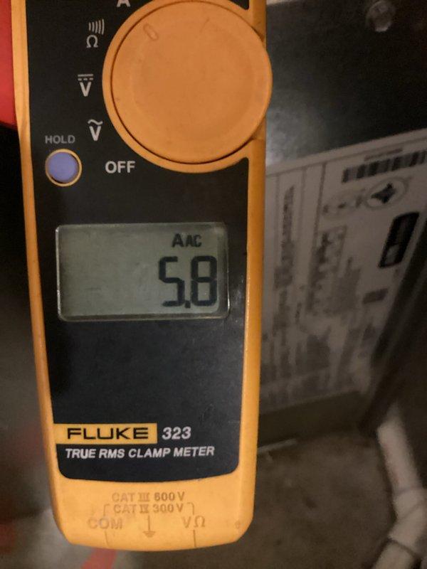 Completed comprehensive air conditioning tune-up and preventive maintenance inspection on residential outdoor condensing unit as part of membership benefits. Performed electrical diagnostics using Fluke 323 True RMS clamp meter, recording 5.8 AAC amperage reading to verify proper compressor and fan motor operation within manufacturer specifications. Inspected condenser coil fins, verified refrigerant line connections, checked electrical connections and contactors, and confirmed unit operational status with all components functioning properly.