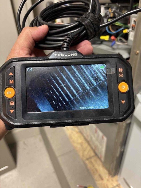 Completed routine A/C tune-up on residential split system as part of membership maintenance program. Performed comprehensive inspection of evaporator coil using borescope camera to verify internal fin condition and cleanliness, confirmed proper airflow through heat exchanger, and inspected all refrigerant lines, electrical connections, and control components. All system components operating within normal parameters with no issues identified.