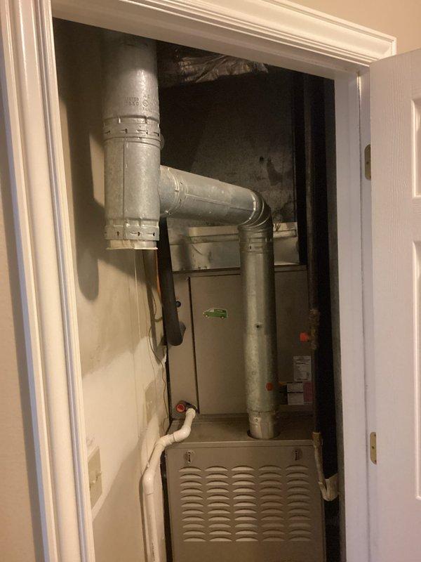 Performed comprehensive tech lead evaluation on dual-zone HVAC system consisting of two furnaces (one basement-mounted, one upstairs closet installation) and two ground-level air conditioning condensers. Assessed aging equipment condition following previous heating maintenance and determined both systems require significant repairs or replacement due to age and deteriorating performance. Presented replacement options including full system upgrades with air scrubber and humidifier integration for improved indoor air quality and humidity control across both zones.