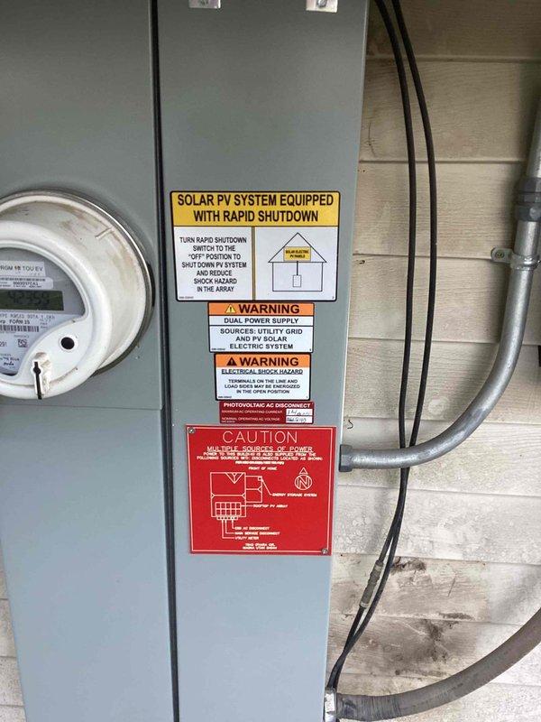 Responded to emergency service call for sparking at main breaker panel and flickering lights following recent HVAC installation. Inspected 37-year-old electrical panel and identified safety hazards requiring immediate attention. Coordinated utility shutdown with power company and obtained necessary permit for complete panel upgrade. Replaced outdated main service panel with new code-compliant electrical panel, installed modern circuit breakers, and rewired all branch circuits with proper connections. Integrated existing solar PV system with rapid shutdown components into new panel configuration, ensuring all dual power supply warning labels and safety signage met current NEC requirements. Verified all connections, tested circuit functionality, and confirmed proper grounding throughout the system.
